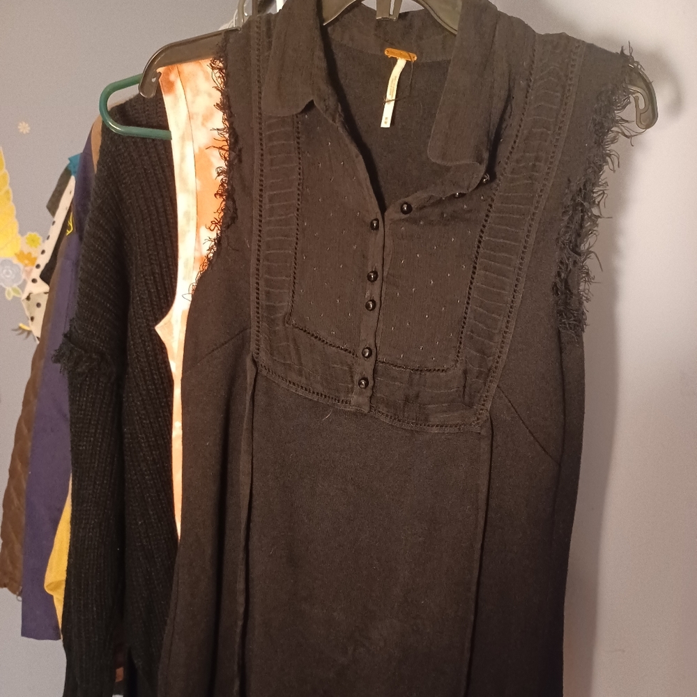 Free people dress. Black w/ blue lacing around the bottom. Mini length.